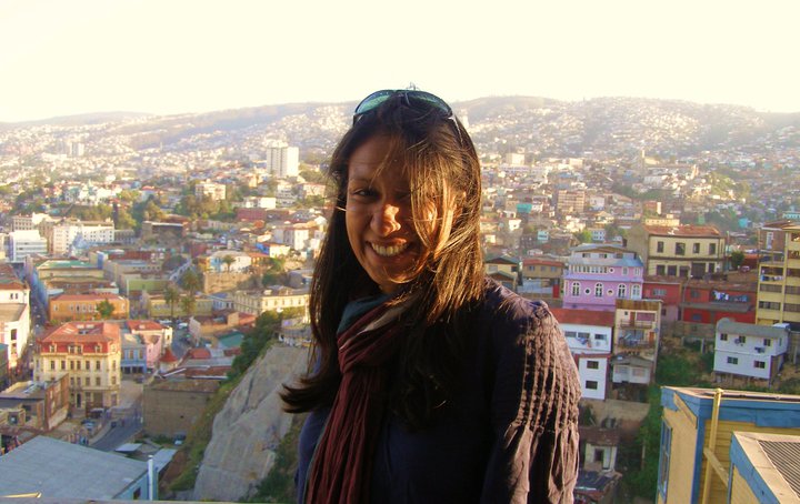 Rubayi in Chile, with the view behind her